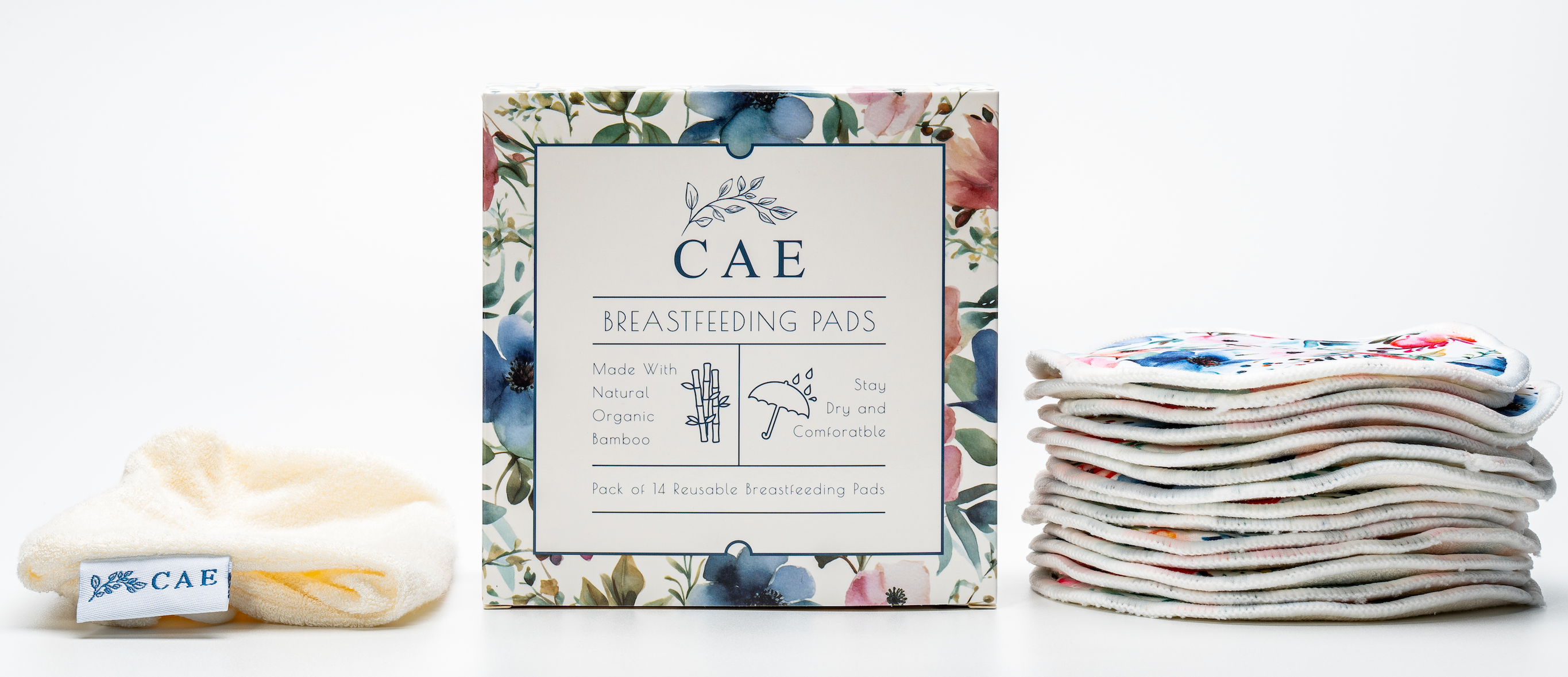 Open CAE box showing washable bamboo breast pads stacked beside it